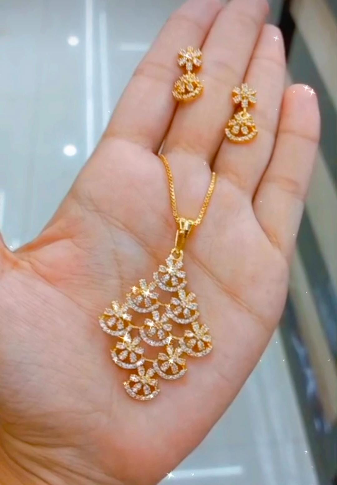 Premium plated American Dimond Pendant with chain & maching Ear studs.DFlower Design Jewel byjuwaan