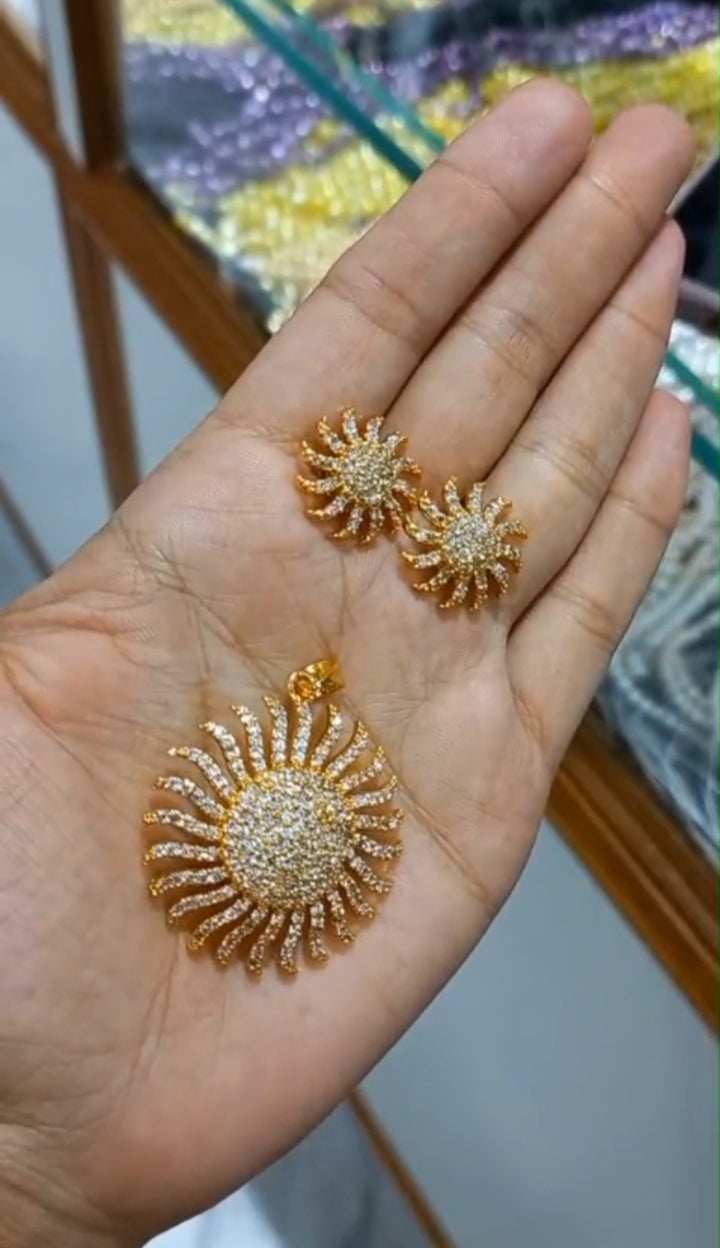 Beautiful  and premium gold plated Pendant with chain and matching studs
Code : SunG1S Jewel byjuwaan